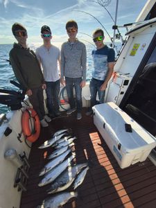 3 anglers with 2 big fish caught while fishing in WI