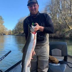 A person holding a fishing rod in Cottage Grove
