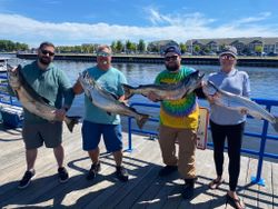 4 anglers with a catch of 4 large fish in Sheboygan