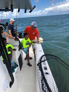 Three people enjoying a fishing trip in VA