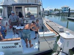 Four people enjoying a fishing trip in Cape Charles