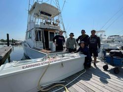 5 people having fun fishing in Cape Charles
