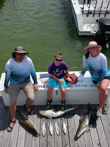 Three people fishing at Cape Charles