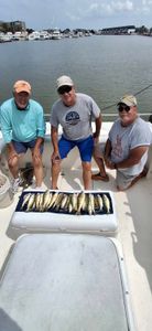 Three people fishing in Port Clinton