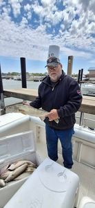 Fishing charter boat with caught fish on deck at Port Clinton OH marina
