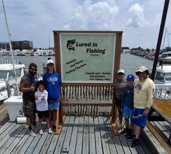 Fishing charter display board showing multiple caught walleye and perch at Port Clinton OH marina