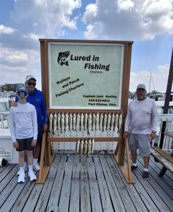 Fishing charter display board showing large catch of walleye and perch from Port Clinton Ohio