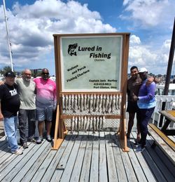 Fishing charter display board showing catch of walleye and perch from Port Clinton Ohio