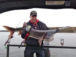 Angler with a big 21-inch fish caught while fishing in OK