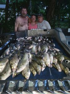 Two people fishing in Oklahoma with their catch