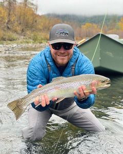 Angler catching a rainbow trout in California