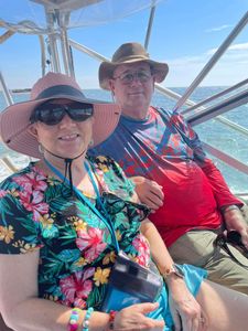 Two people enjoying a fishing adventure in Gulfport