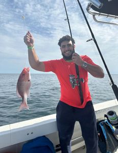 Angler with a catch in Shalimar