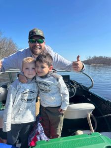 Three people enjoying a fishing trip in Fort Atkinson