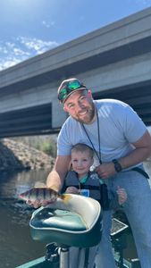 Angler holding a yellow perch fish in WI