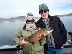 Smiling anglers in Reno with fishing gear