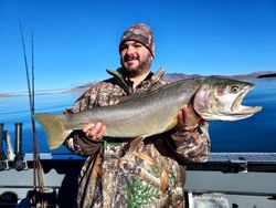 Angler with big fish caught while fishing in CA