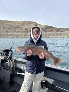 Photograph of an angler fishing for a rainbow trout in California