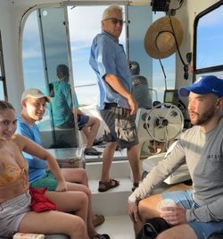 Four people on a boating trip in Florida, enjoying cruises, fishing, and tours