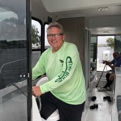 Two people enjoying a cruise and fishing tour in Homosassa