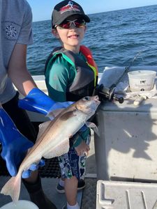 Boy enjoying his catch.