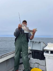 Man proudly holding his catch!