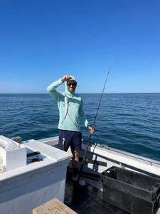 Man smiling with his prized catch.