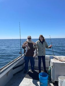 Two anglers with fishing rods in Gloucester