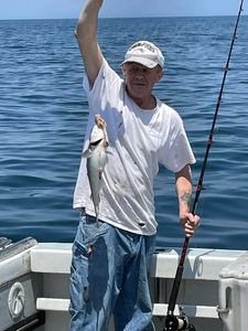 Angler holding a 14-inch fish in Gloucester