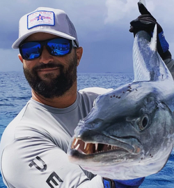 Angler proudly showcasing their catch in PR