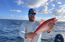 A lone angler fishing in the waters of San Juan