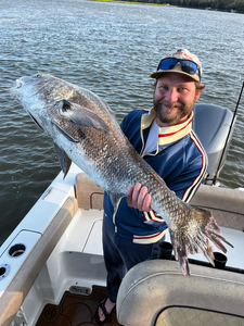 Great catch using deep sea jigging and light tackle in partly cloudy conditions!