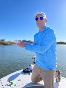 Enjoying a peaceful day on the water with a catch.
