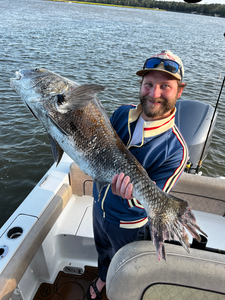 Nice catch using deep sea jigging and light tackle in partly cloudy conditions!