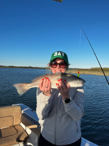 Reeling in a good one on this peaceful day.