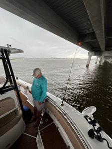 Exciting deep sea jigging and trolling adventure on calm waters with light tackle setup.