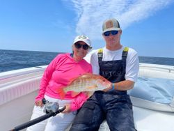 Two anglers with their fishing gear at Panama City Beach