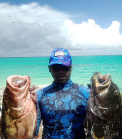 Two small fish caught while fishing in Andros Town