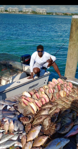 A person fishing in Andros Town