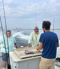 Three people enjoying fishing in NJ
