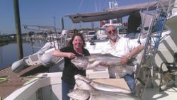 Two people fishing with one big fish in NJ