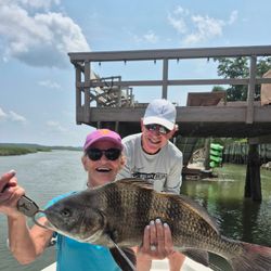 Anglers with a large black drum fish caught in SC