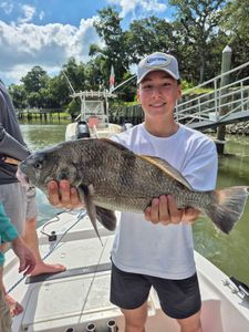 Angler with a 26-inch black drum fish in SC