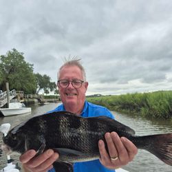 A person fishing for a black drum fish on Hilton Head Island