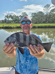 Reeling in the Black Drum with light tackle on a stormy Hilton Head day!