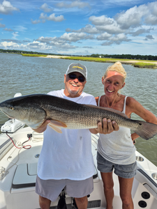 Great catch using light tackle and jigging techniques in these partly cloudy conditions!