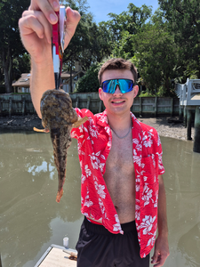 Reeling in an Oyster Toadfish on a crystal clear day at Hilton Head!