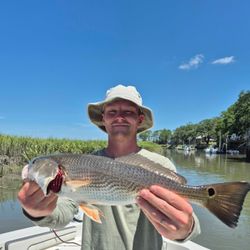 Angler holding a large redfish caught in SC