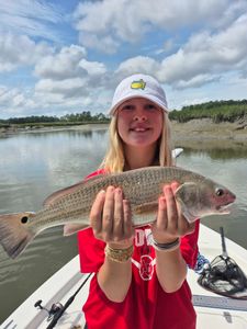 Angler holding a large redfish in South Carolina