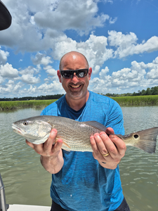 Partly cloudy skies set the stage for epic redfish action!